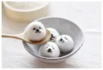 DIY Kawaii Roly Poly Rice Balls in a bowl, featuring cute animal faces. A kawaii diy kit.