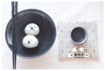 DIY Kawaii Roly Poly Rice Balls, two adorable bear-shaped creations in a bowl.
