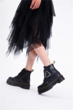 Black kawaii platform heart boots with chunky sole and buckle detail.