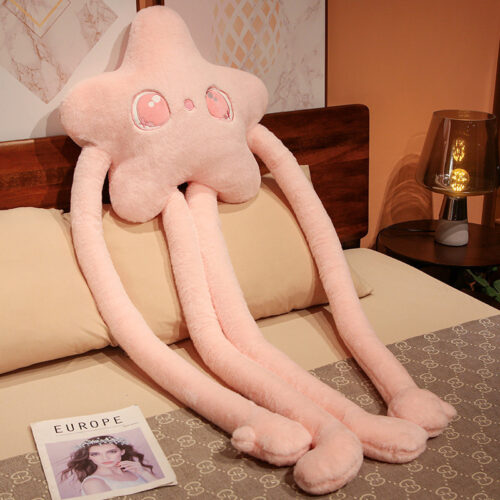 Pink long limb plushie with flowing tentacles, featuring embroidered eyes and a soft texture.