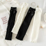 Cute Bow Gyaru Socks: Black, white, and cream ribbed socks with bow accents.