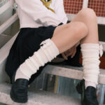 Cute Bow Gyaru Socks in a white knit, featuring decorative bows. Kawaii aesthetic legwear.