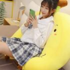 Cute yellow banana plushies in a three-pack edition, showcasing a plush toy with a smiling face.