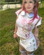 A pink cutecore aesthetic tee featuring a cartoon character and floral design.