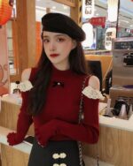 Red coquette aesthetic top with lace sleeves and a round neck detail.