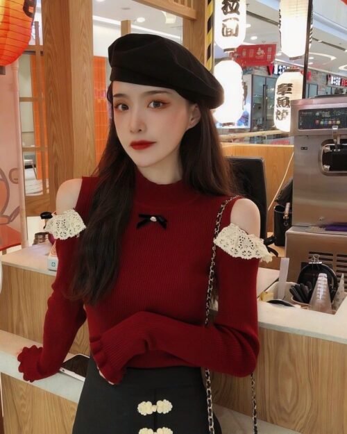 Red coquette aesthetic top with lace sleeves and a round neck detail.