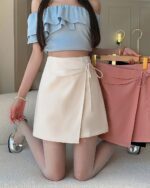 Light pink and white lace-up korean fashion skirt with a wrap style.