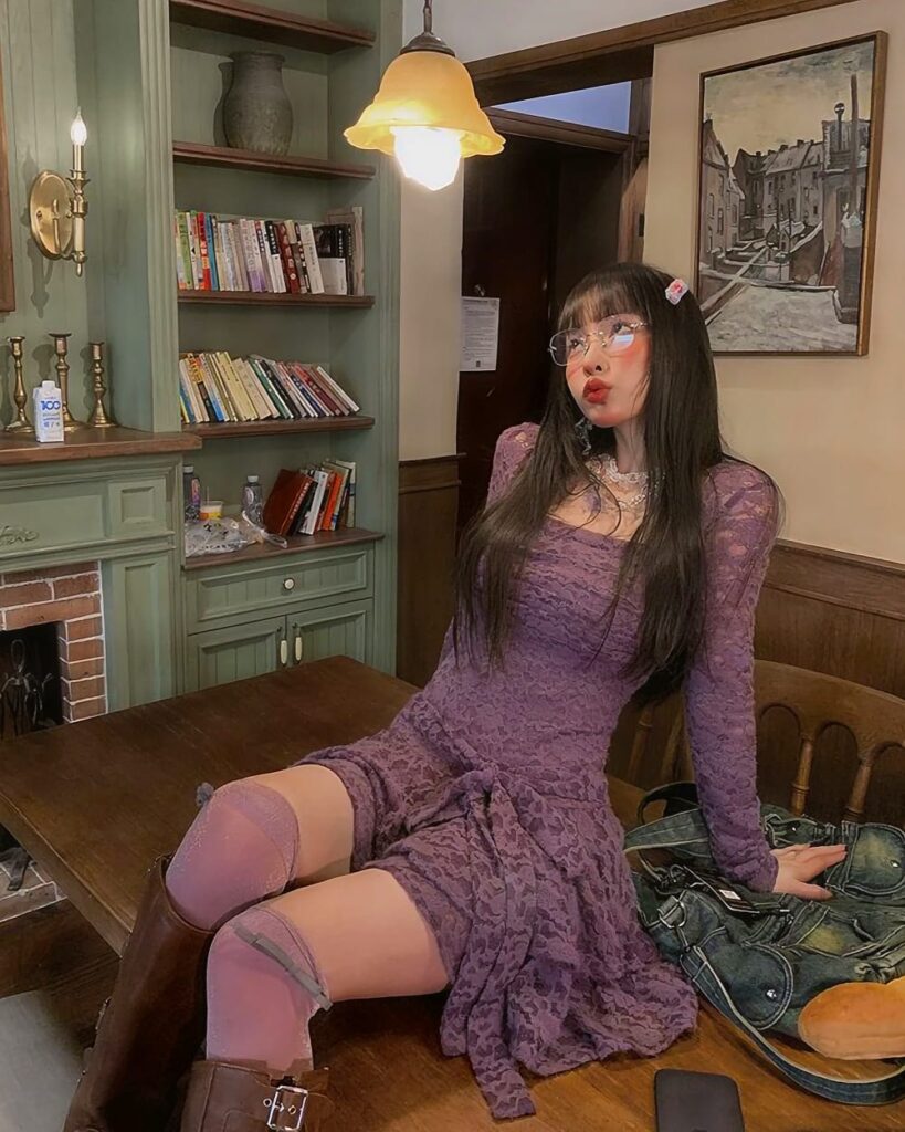 Purple lace gothic aesthetic dress worn by a woman in an interior setting.