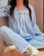 Light blue milk silk korean aesthetic pajamas with a ruffled neckline and matching pants.