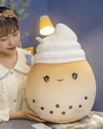 Cute brown bubble tea plushie with white topping and eyes.
