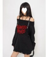 Black gothic aesthetic sweater with ripped detailing and straps.
