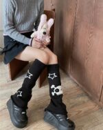 Black gyaru leg warmers with star and skull patterns.