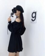 Solid black gothic aesthetic dress with off-the-shoulder sleeves and a floral mask.