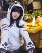 Kawaii Neko Atsume hoodie featuring pickle design, shown on a person.