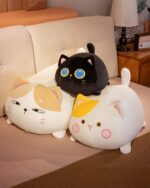 Kawaii chonky cat plushie - two soft, adorable stuffed animals displayed on a couch.