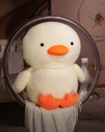 Close-up of a kawaii duck plushie, Winston the Duck, featuring a white fluffy body and orange beak.