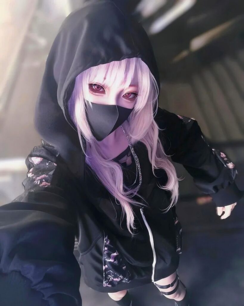 Woman wearing a black harajuku aesthetic jacket with floral design details, hoodie, and mask.