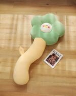 Kawaii angry flower plushie pillow with removable head, light green and beige colors.