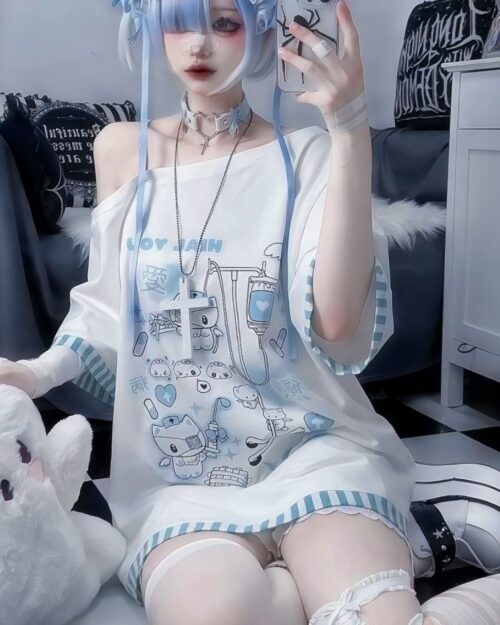 Blue nurse cat shirt with cute medical illustrations, cutecore aesthetic.