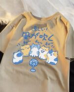 Cat and dog tee design featuring cute cartoon cats and dogs with a fan.