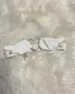 White kawaii leg accessory featuring a winged heart and crosses.