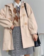 Light pink kawaii woolen coat with toggles and hood, styled with a school uniform outfit.
