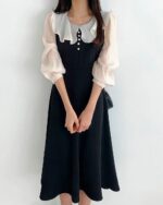 Black puff sleeve dress featuring a french aesthetic dress ruffle collar and sleeves.