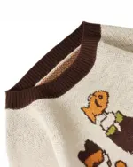 Close-up of a cat reunion sweater with retro cartoon cats. Cat reunion sweater.