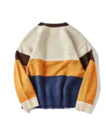 Back view of a cat reunion sweater featuring a retro color block design in beige, brown, navy, and gold.
