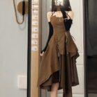 Brown retro aesthetic dress with spaghetti straps and ruffled skirt.