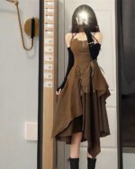 Brown retro aesthetic dress with spaghetti straps and ruffled skirt.