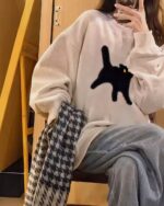 Oversize cat graphic sweater in white with a black cat design, harajuku fashion.