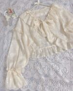 Off-white fairycore sleeve bow, delicate ruffles, kawaii clothes accessory.