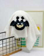 Cute Halloween Decor - Ghost Plush toy, a fluffy white ghost with black eyes and mouth.