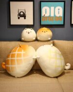 Kawaii Melonwan plushies: orange and white melonwan dog plushies displayed together.