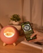 Kawaii cat lamp featuring a sleeping cat inside a pink, rounded light fixture. Little Pet House® brand.