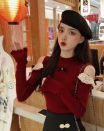 Red coquette aesthetic top featuring a long-sleeved, hollow-out design and lace accents.