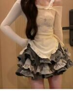 Y2k lolita set featuring a long-sleeved top and layered, ruffled skirt.