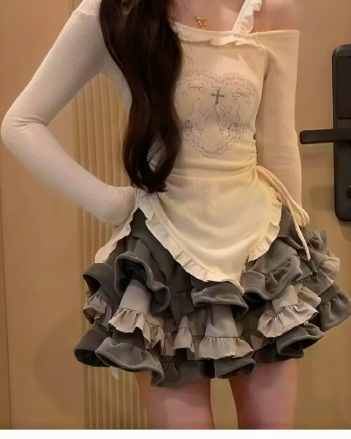 Y2k lolita set featuring a long-sleeved top and layered, ruffled skirt.