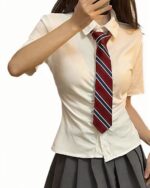 Woman wearing a Summer Uniform Set - Preppy Aesthetic, featuring a short-sleeved shirt and striped tie.
