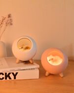 Kawaii cat lamp Little Pet House® featuring a sleeping cat inside a pink resin design.