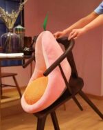 Kawaii fruit cushion depicting a peach-shaped seat cushion on a chair.
