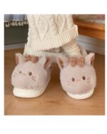 Kawaii cat slippers featuring plush, pink cat ears and bows on a fluffy sole.