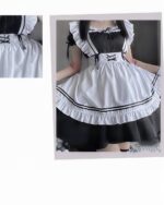 Black and white lolita maid costume with ruffles, lace, and a corset-style bodice. A classic lolita maid costume.