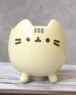 Cute Pusheen flower pot featuring the popular character in a soft yellow color.