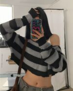 Black and white striped retro aesthetic sweater, off-the-shoulder style.