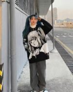 Black Harajuku sweater featuring anime-style illustration, oversized fit.