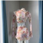 Four-piece kawaii aesthetic swimsuit set, featuring a crop top and skirt.