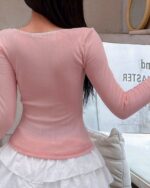 Pink soft girl pullover with a square neckline and ribbed texture.