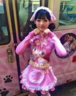 Model wearing a pink y2k animecore shirt featuring an anime character print.